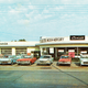 Illustration for article titled Proof used car dealerships were a lot more interesting in 1962